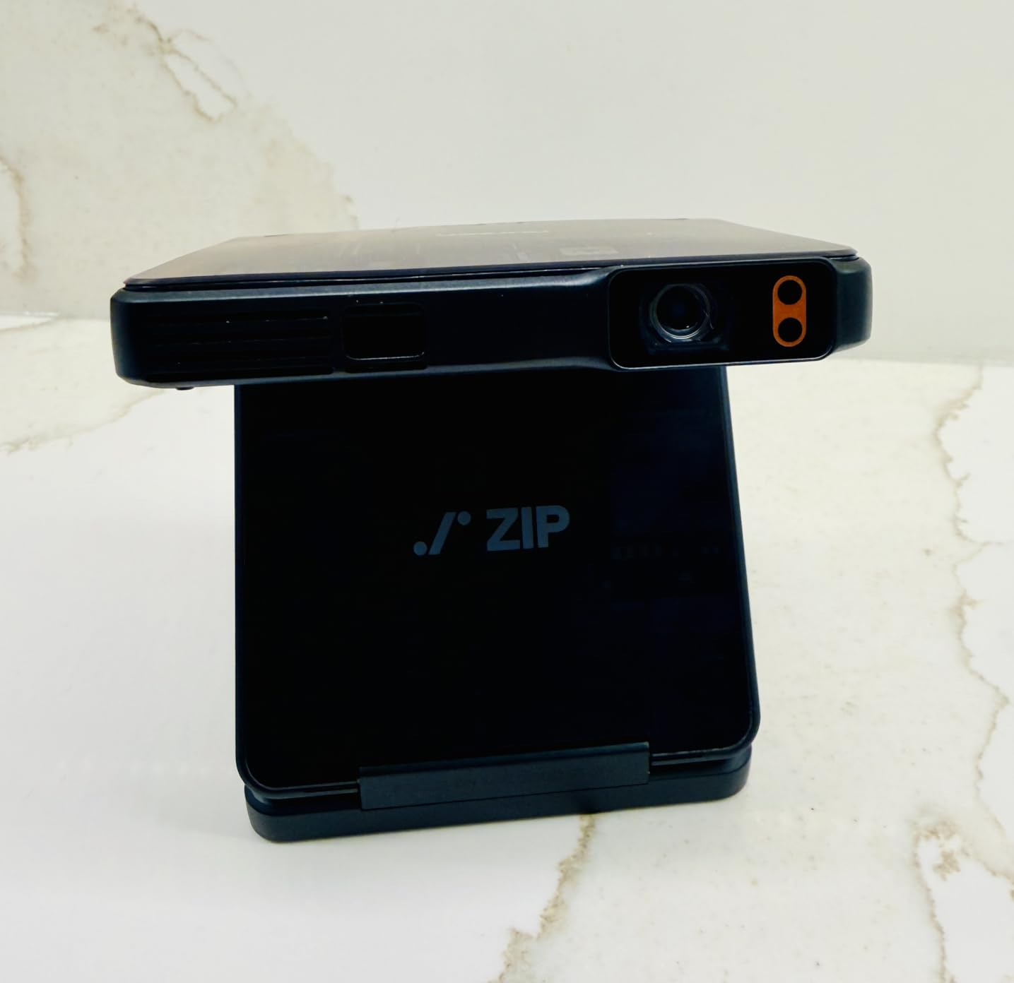 Aurzen ZIP Tri-Fold DLP Pocket Cinema Mini Projector, Small Cookie Projector with Bluetooth, ToF Auto Focus, 1.5H Play, USB-C, Pico Projector for Drawing, Art Tracing, Sewing, Travel, Camping, Gold customer photo 1