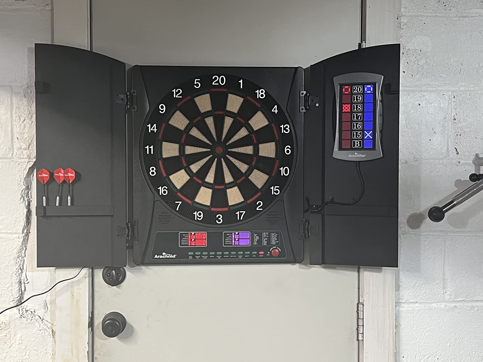 Arachnid CricketMaxx 1.0: 13.5” recreation size with wood cabinet. Features 34 games, 183 variations, 8-player LED X/O scoring, and Heckler mode. Integrated storage for darts and accessories customer photo 2