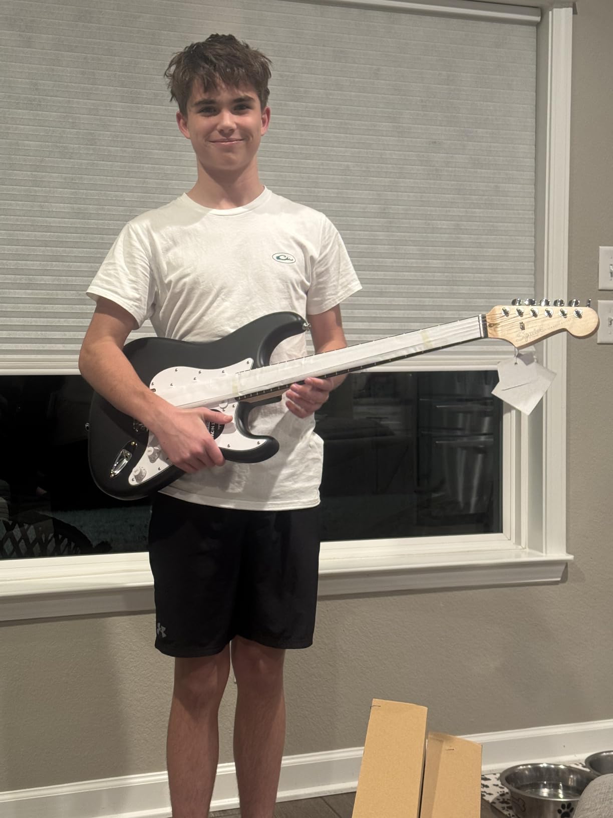 Fender Squier Debut Stratocaster Beginner Electric Guitar Kit, Matte Black | Complete starter pack with Frontman 10G amp, padded gig bag, strap, free lessons, 2-year warranty included customer photo 1