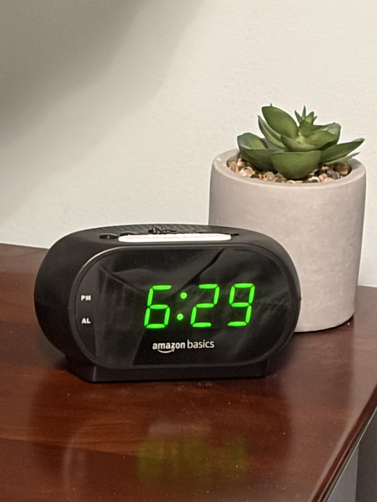 Amazon Basics Small Digital Oval Alarm Clock with LED Display, Nightlight, Snooze Function & Battery Backup, Black, 4.5 x 3.5 x 2.4 Inches customer photo 2