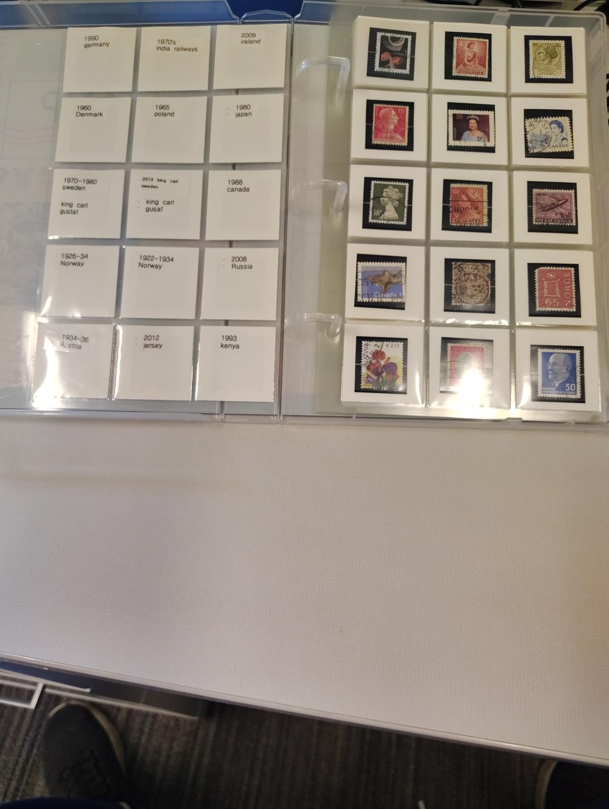 Stamp Collection Album Binder with 10 Archival Safe Pages - Compact 3-Ring Postage Stamp Storage Case with Snap Lock, Holds 150-300 Stamps - Includes 150 Mounting Squares, 1.25